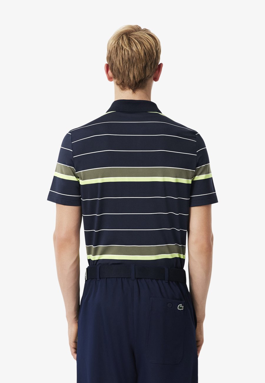 Поло Lacoste Polo shirt, Bleu Marine Vert Kaki Jaune Fluo-Ai/Dark Blue — фото 3