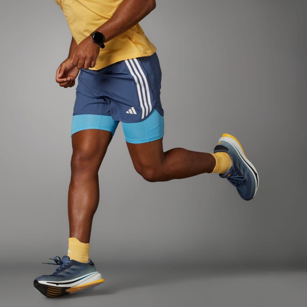 

Шорты Adidas OWN THE RUN 3-STRIPES 2-IN-1 SHORTS, цвет Pre-Rubbed Ink