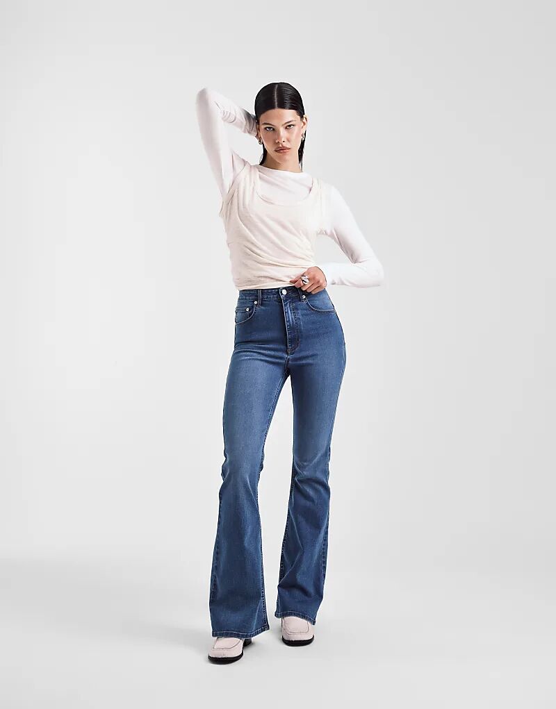 

Суперэластичные джинсы-клеш ASOS DESIGN темно-синего цвета