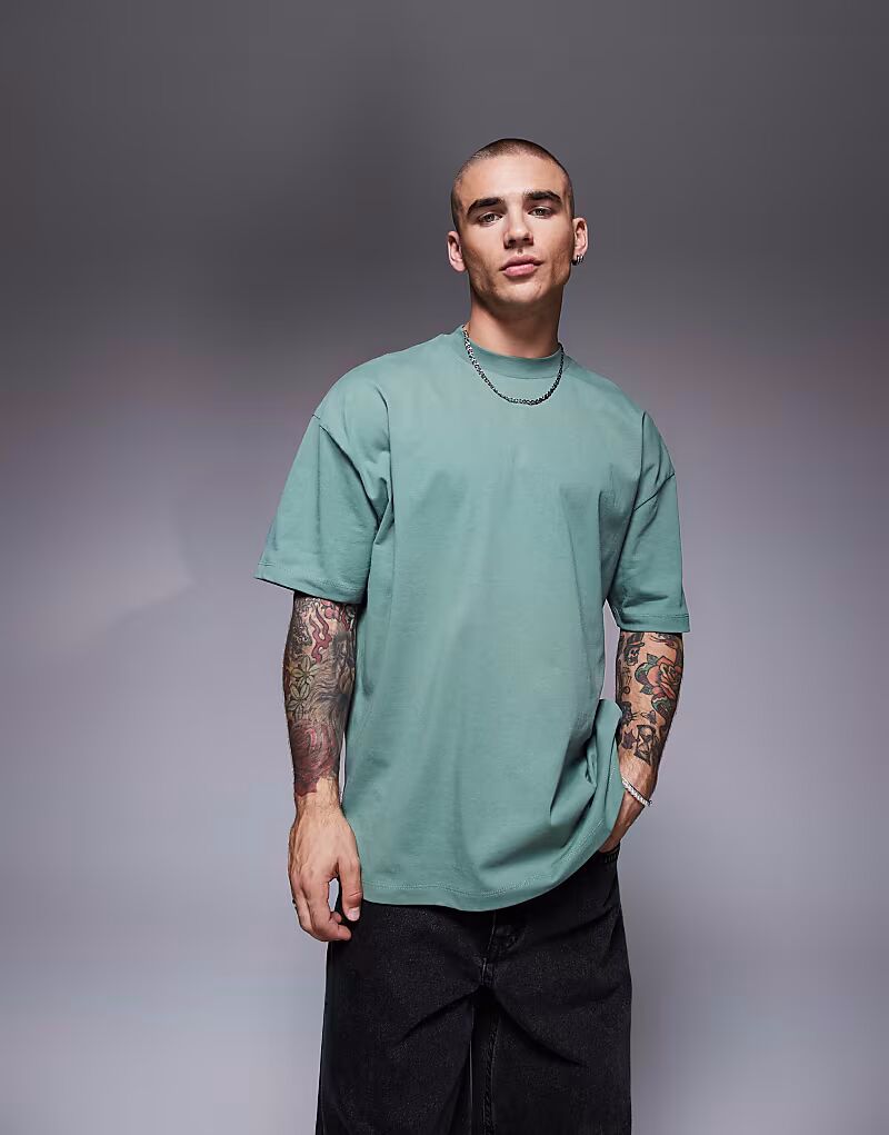 

Футболка свободного кроя ASOS DESIGN зеленого цвета с текстовой графикой