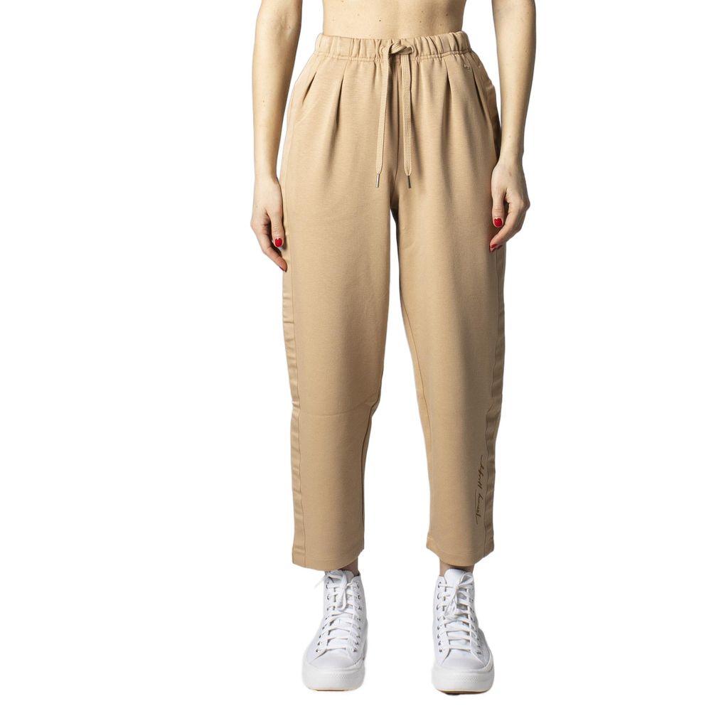 

Бежевые джинсы и брюки из полиэстера Tommy Jeans