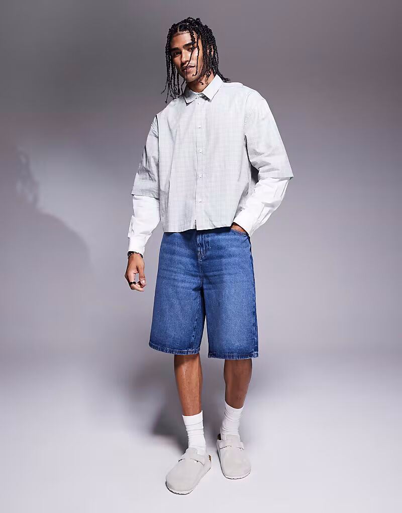 

Удлиненные джинсовые шорты ASOS DESIGN в цвете полувыбеленный синий