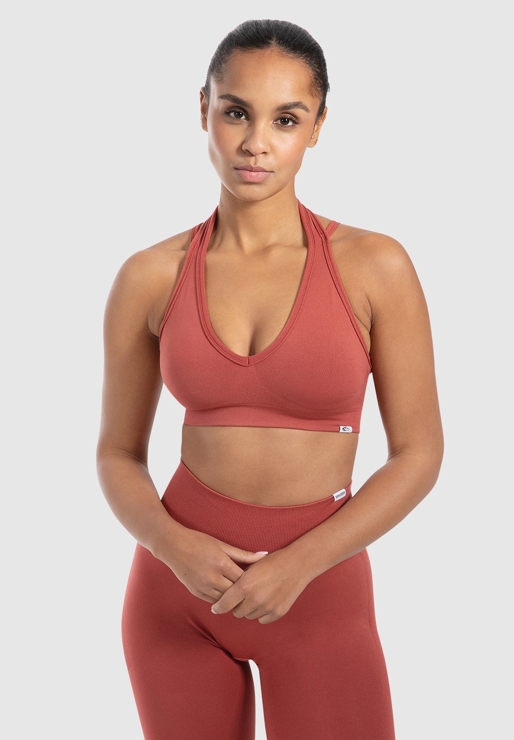 

Спортивный бюстгальтер с легкой поддержкой YARA SEAMLESS NECKHOLDER Smilodox, лососево-розовый