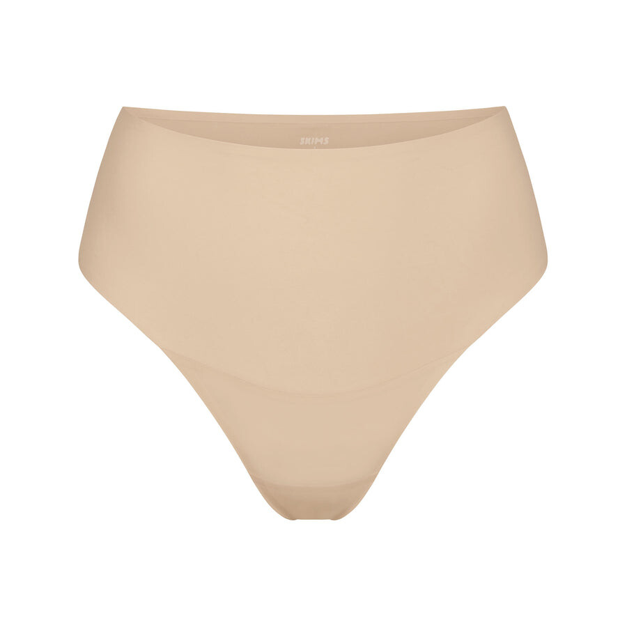 

Стринги с высокой талией SKIMS Smoothing Intimates, песочный