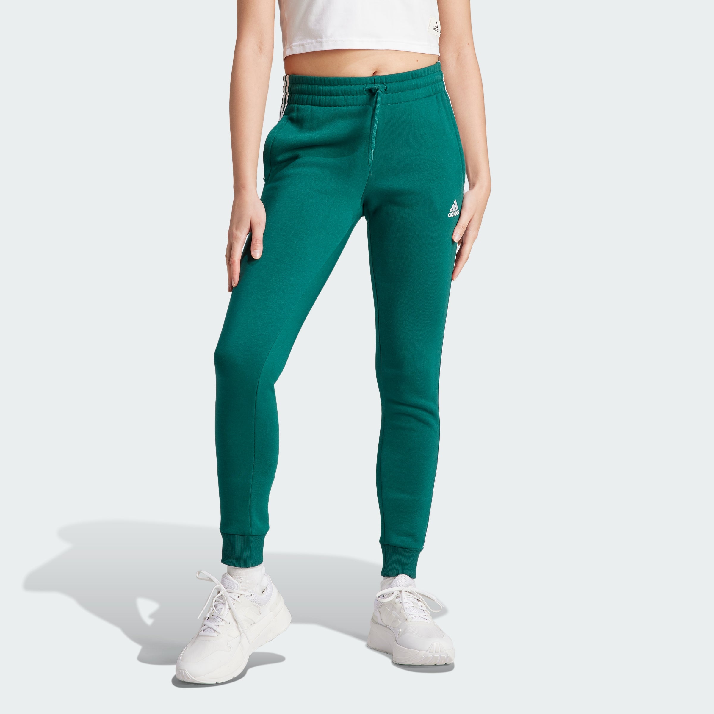 

Женские флисовые брюки Adidas Essentials с тремя полосками, цвет collegiate green / white / il3284
