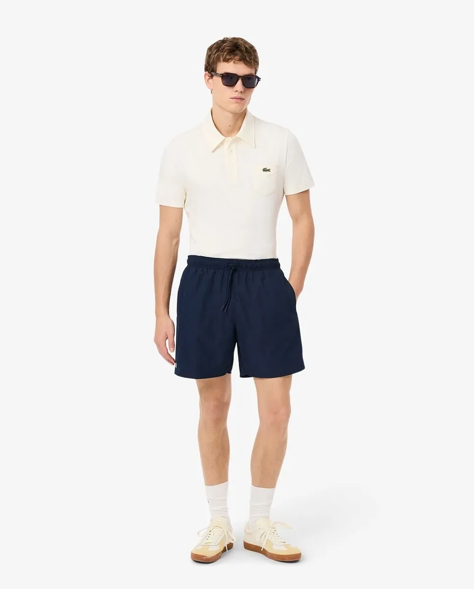 

Однотонные мужские шорты для плавания средней длины Lacoste, тёмно-синий