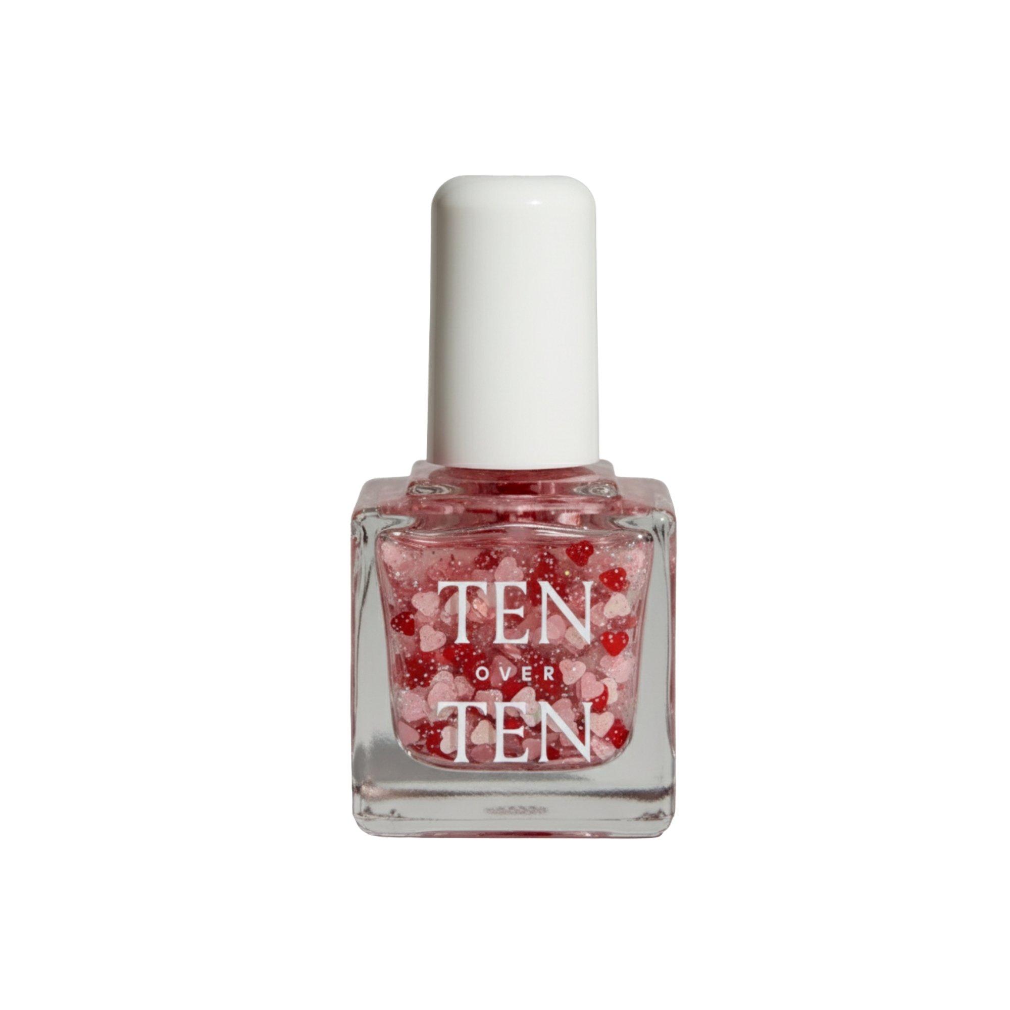 

Лак для ногтей Tenoverten, Amour (Sheer glitter polish, sprinkled with light pink and red hearts.)