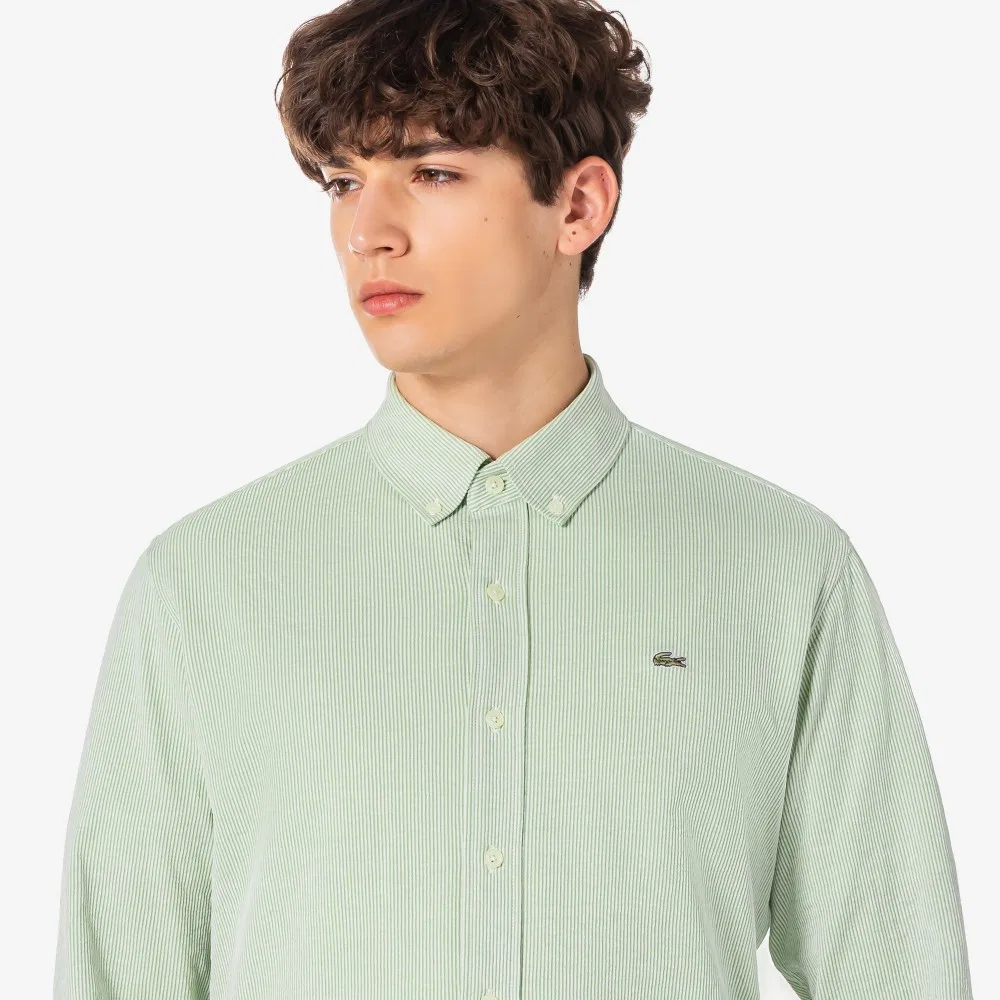 Мужская трикотажная рубашка в полоску, зелёная, от Lacoste — фото 2