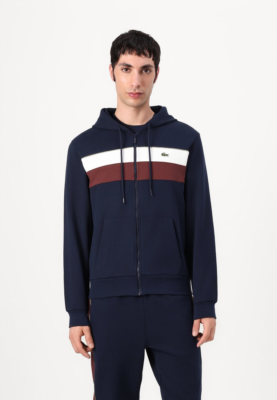 

Худи Lacoste Hoodie, Navy Blue/Flour/Red Vermouth/Dark Blue
