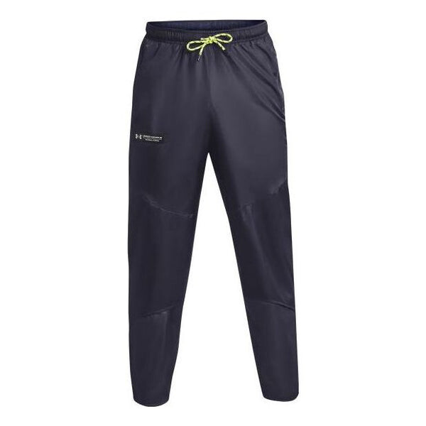 

Брюки rush woven pants 'dark grey' Under Armour, серый