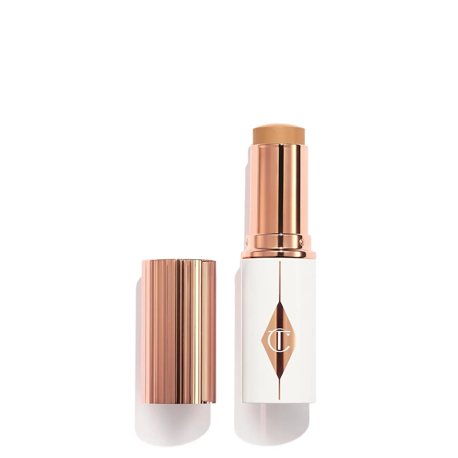 Charlotte Tilbury Unreal Skin Tint & Sheer Glow Hydrating Foundation Stick - тональная основа с увлажняющим эффектом, легкое покрытие и накопительная формула, 09 Tan - Medium-tan with neutral undertones