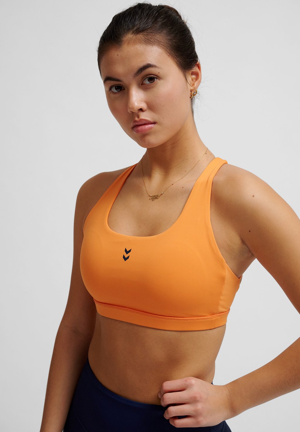 

Спортивный бюстгальтер FAST IMPACT STRAP Hummel, оранжевый