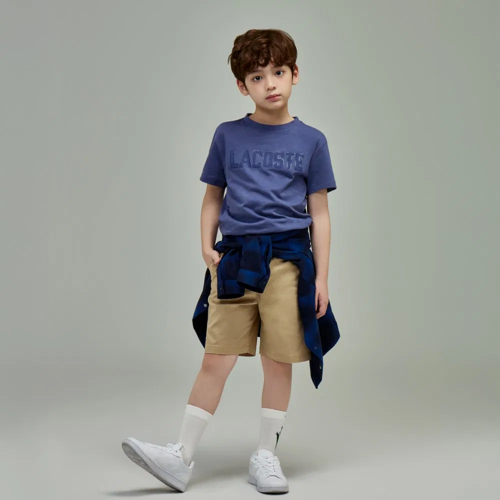 Детская футболка с коротким рукавом и надписью цвета айвори меланж от Lacoste