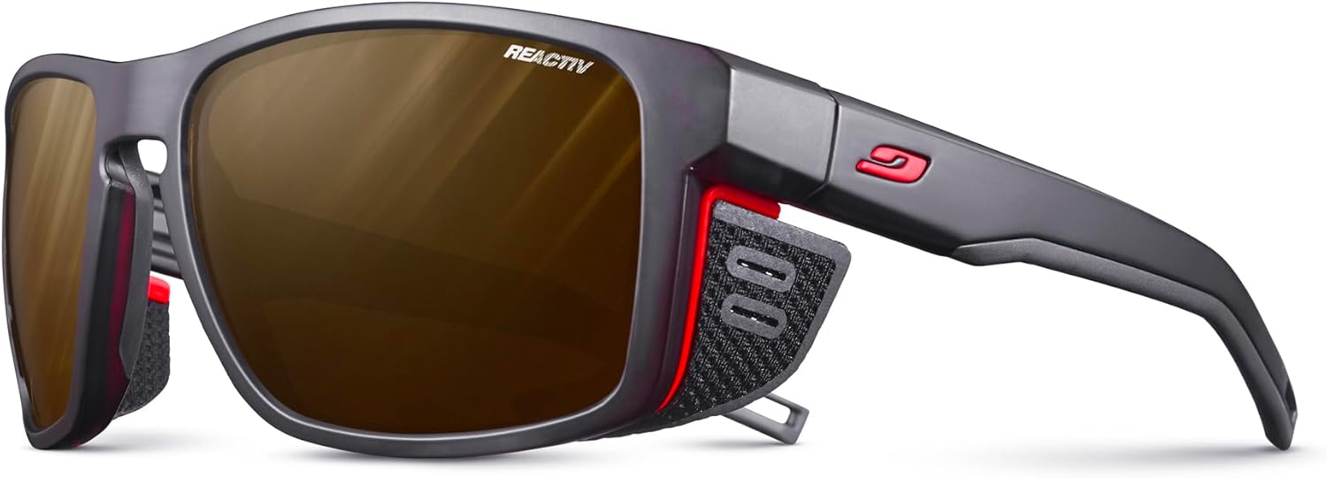 

Очки Julbo Shield Glacier для мужчин и женщин со съемными боковыми щитками для походов, снега/бликов - 100% защита от УФ-излучения, Transluscent Black / Neon Orange Frame - Brown Lens (Reactiv 2-4 Polarized)
