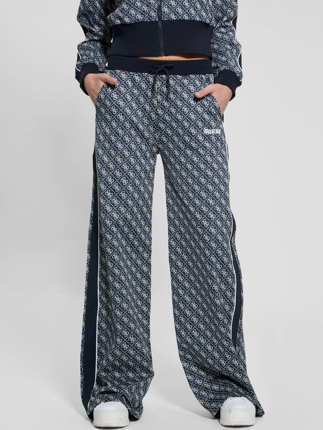 

Спортивные брюки GUESS ACTIVE SARAH flare fit, темно-синий