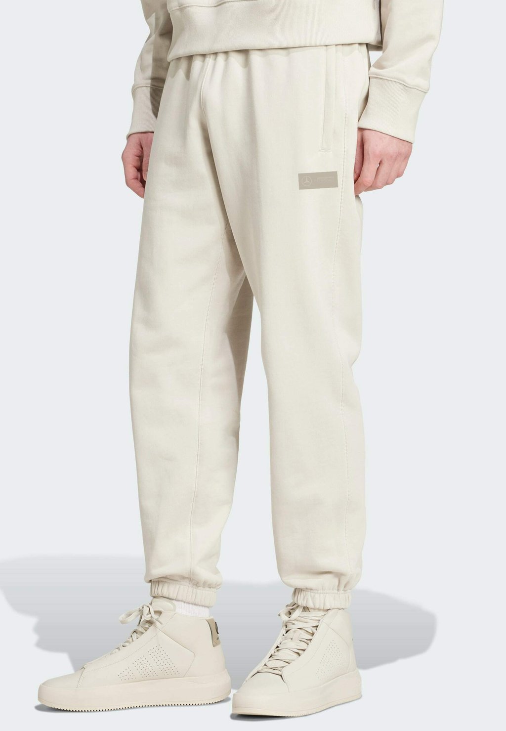

Спортивные штаны MOTORSPORT TEAM MERCEDES AMG PETRONAS F1 LOOSE Adidas Originals, бежевый