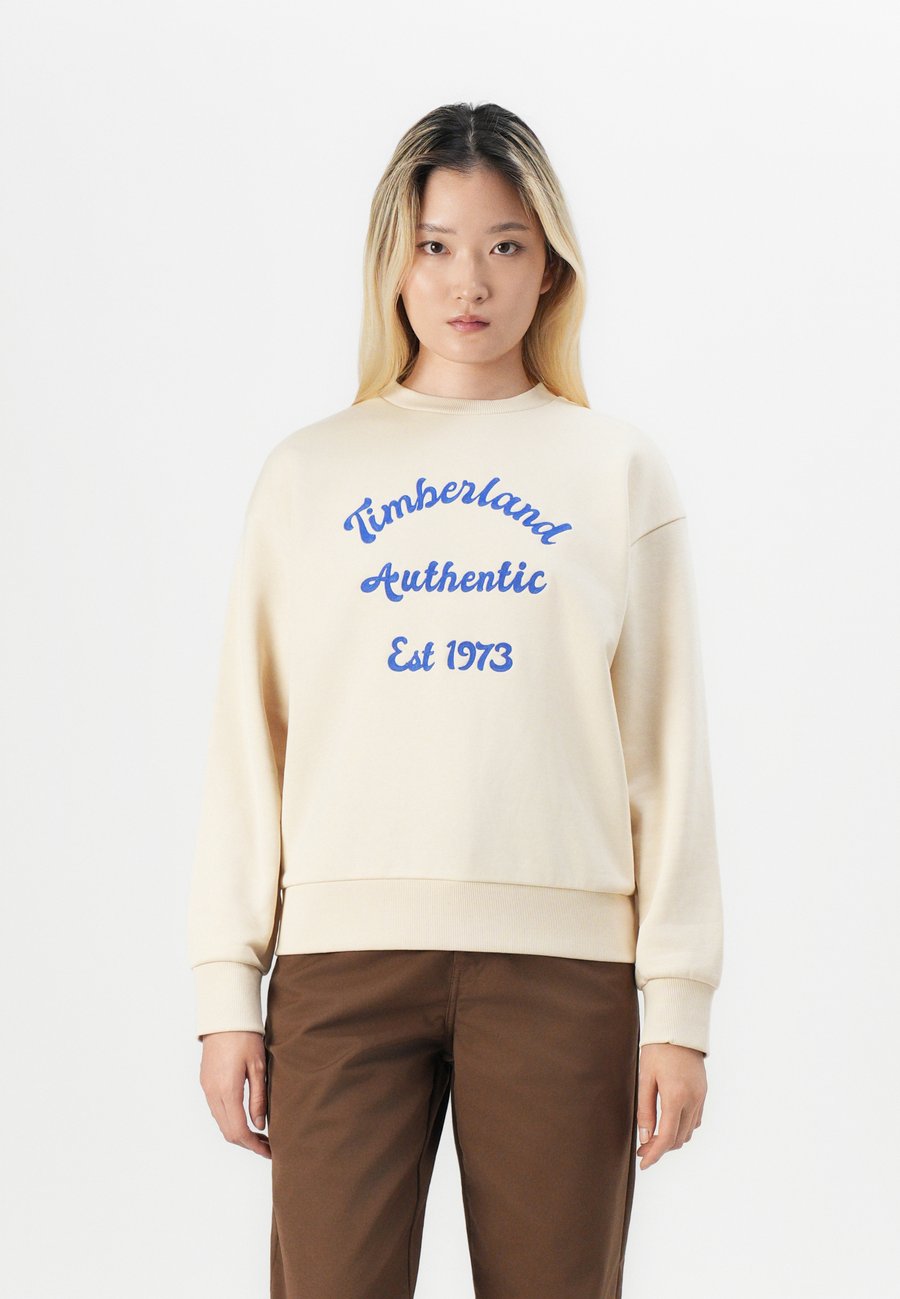 

Толстовка Timberland BRUSHED BACK CHEST GRAPHIC CREW , Angora/Off-White
