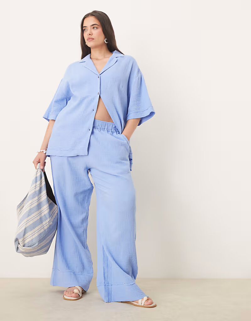 

Брюки-клеш Curve из джерси с необработанными краями, синие Asos Design