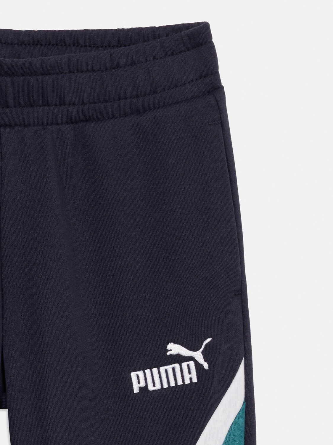 PUMA Узкие спортивные штаны 'Ess' в цвете Navy — фото 3