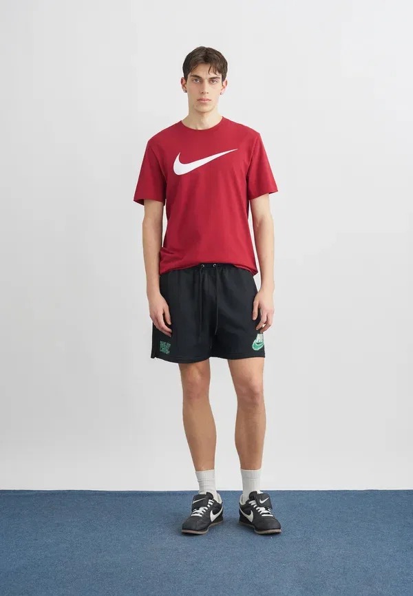 Спортивные штаны Nike Sportswear Club Flow, черный/малахитовый — фото 2
