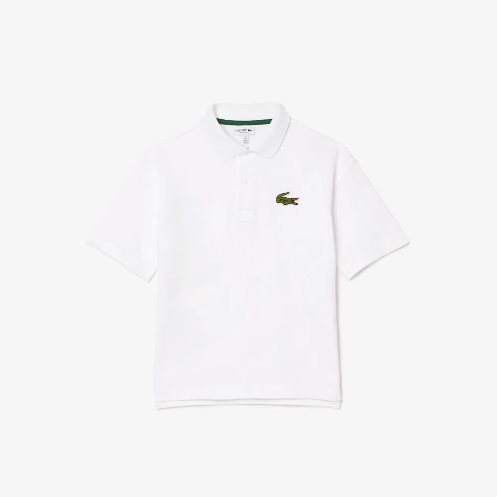 Детская рубашка-поло свободного кроя с коротким рукавом белого цвета от Lacoste — фото 2