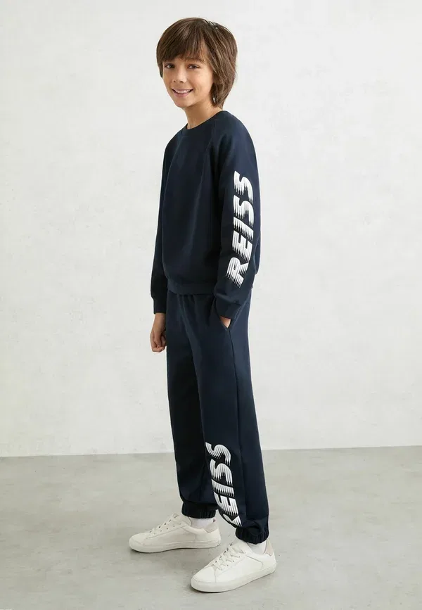 Спортивные штаны с манжетами Ruff logo print cuffed joggers tracksuit bottoms Reiss, темно-синий — фото 3