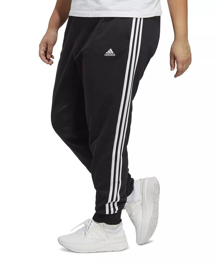 

Большие размеры Essentials 3-полосатые хлопковые футеровые брюки с манжетами adidas, черный