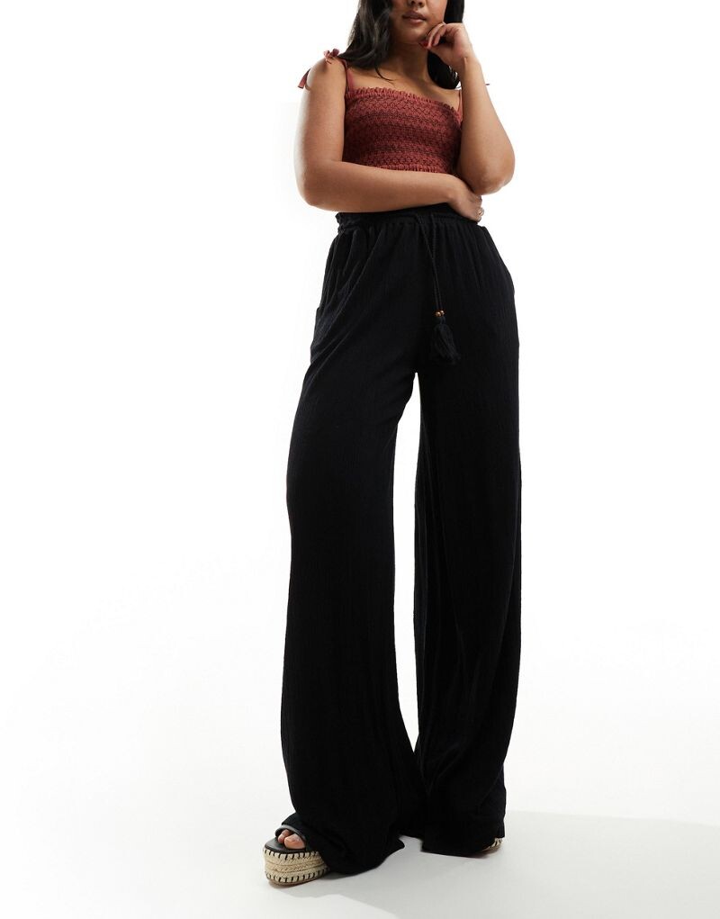 

Черные текстурированные широкие брюки с завязкой на талии ASOS DESIGN