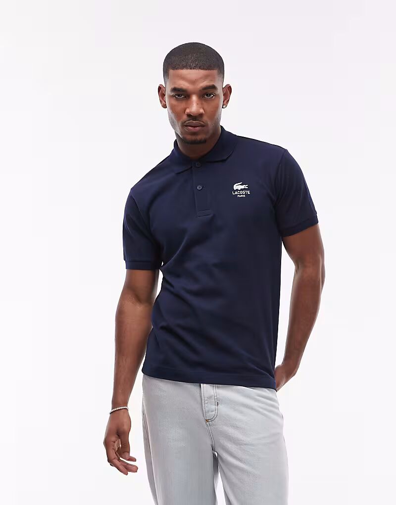 

Рубашка поло Lacoste темно-синего цвета с белым логотипом