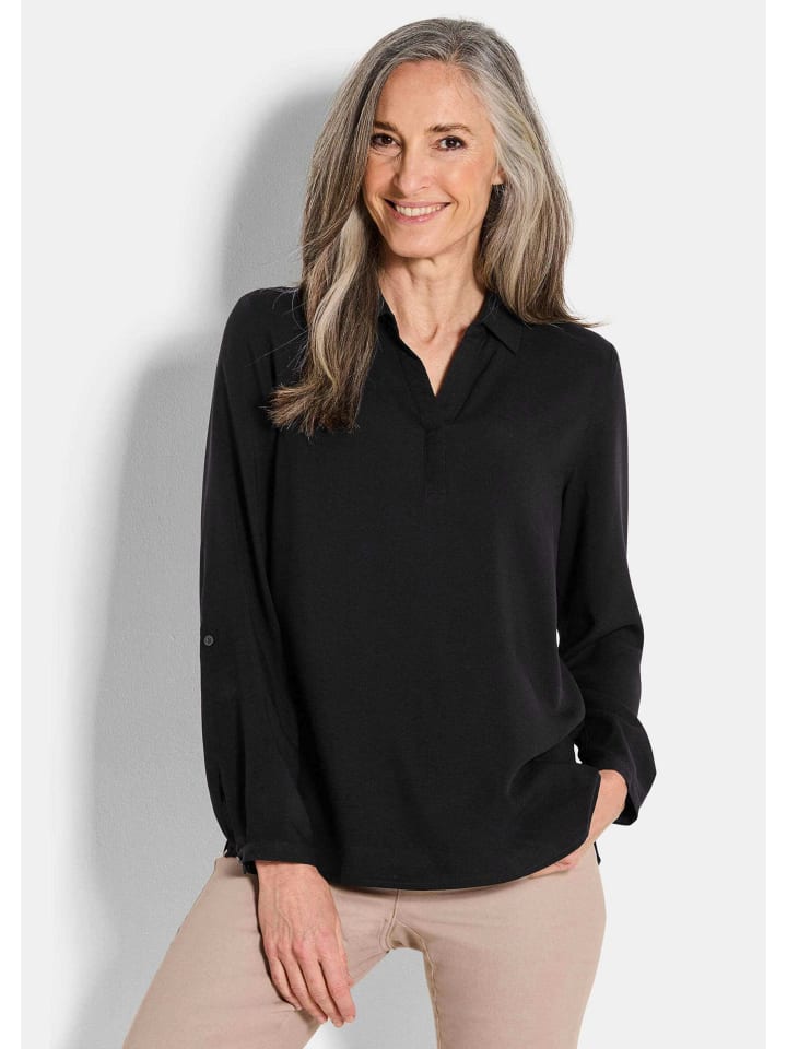 

Блузка без застежки: классическая вискозная блузка с воротником-стойкой черного цвета. GOLDNER