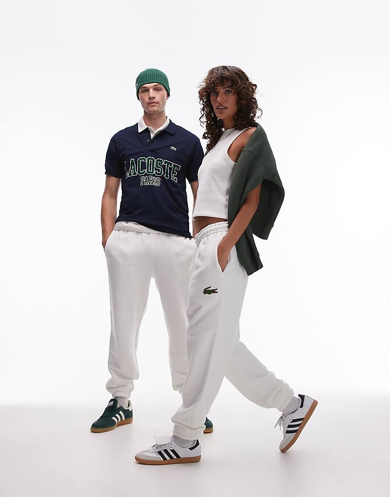 

Белые джоггеры с логотипом Lacoste
