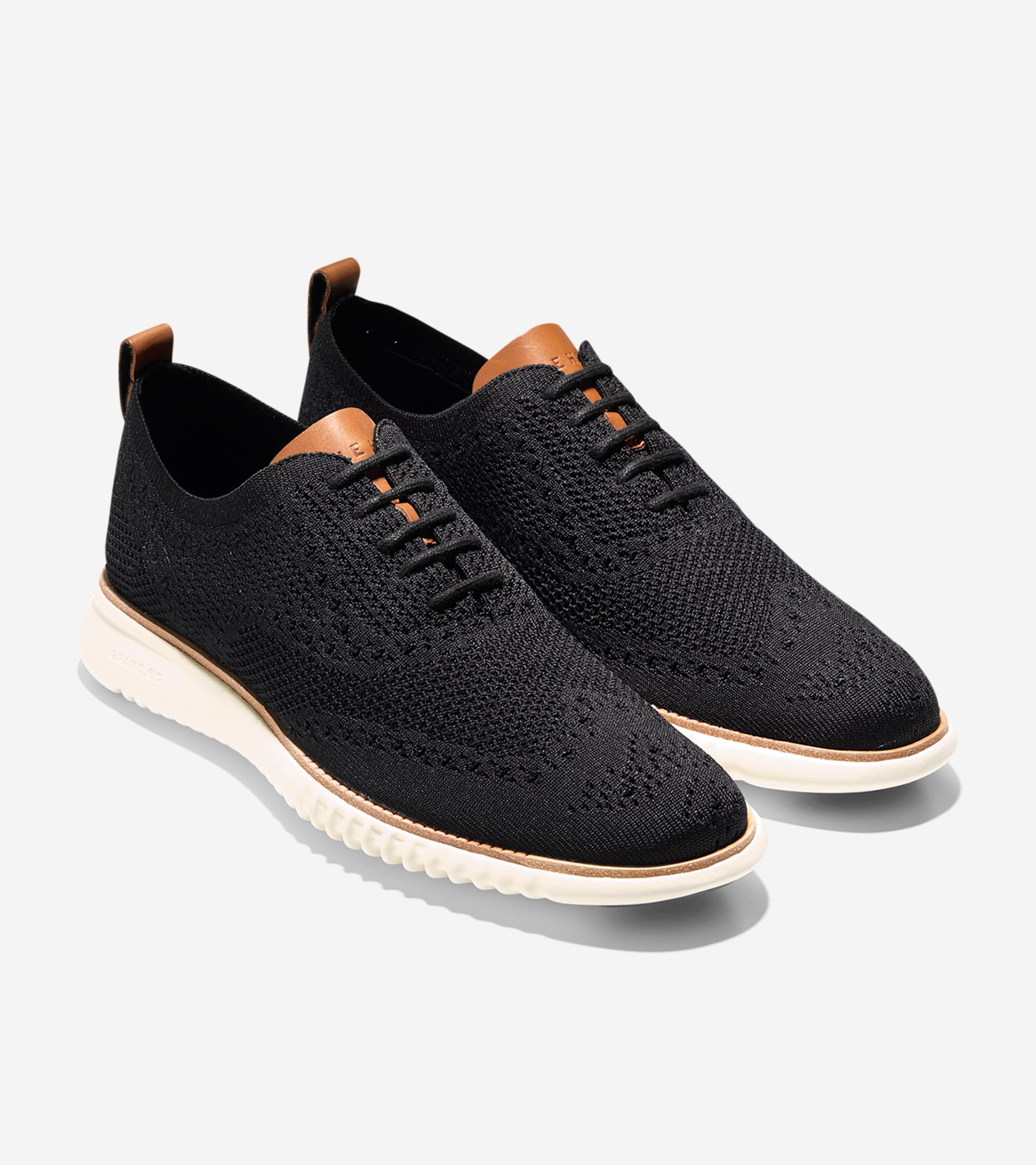 

Cole Haan Мужские оксфорды 2.ZEROGRAND Wingtip Oxford, цвет black stitchlite-ivory