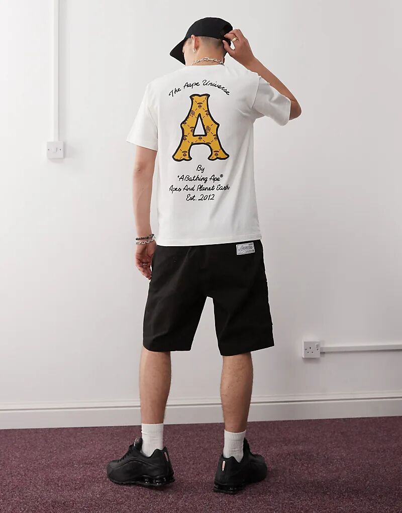 

Футболка с принтом логотипа на спине Aape By A Bathing Ape кремового цвета Aape By A Bathing Ape