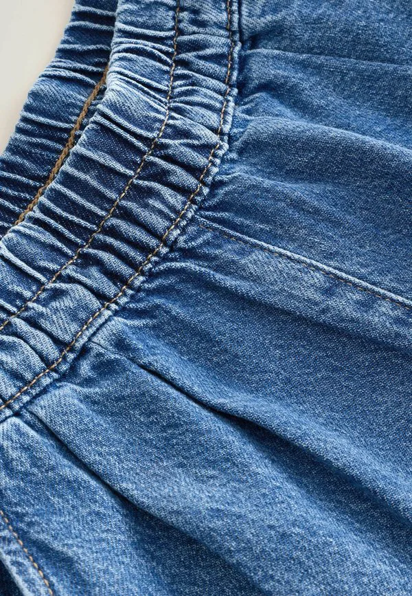 

Наденьте широкие мешковатые джинсы Next, Mid Blue