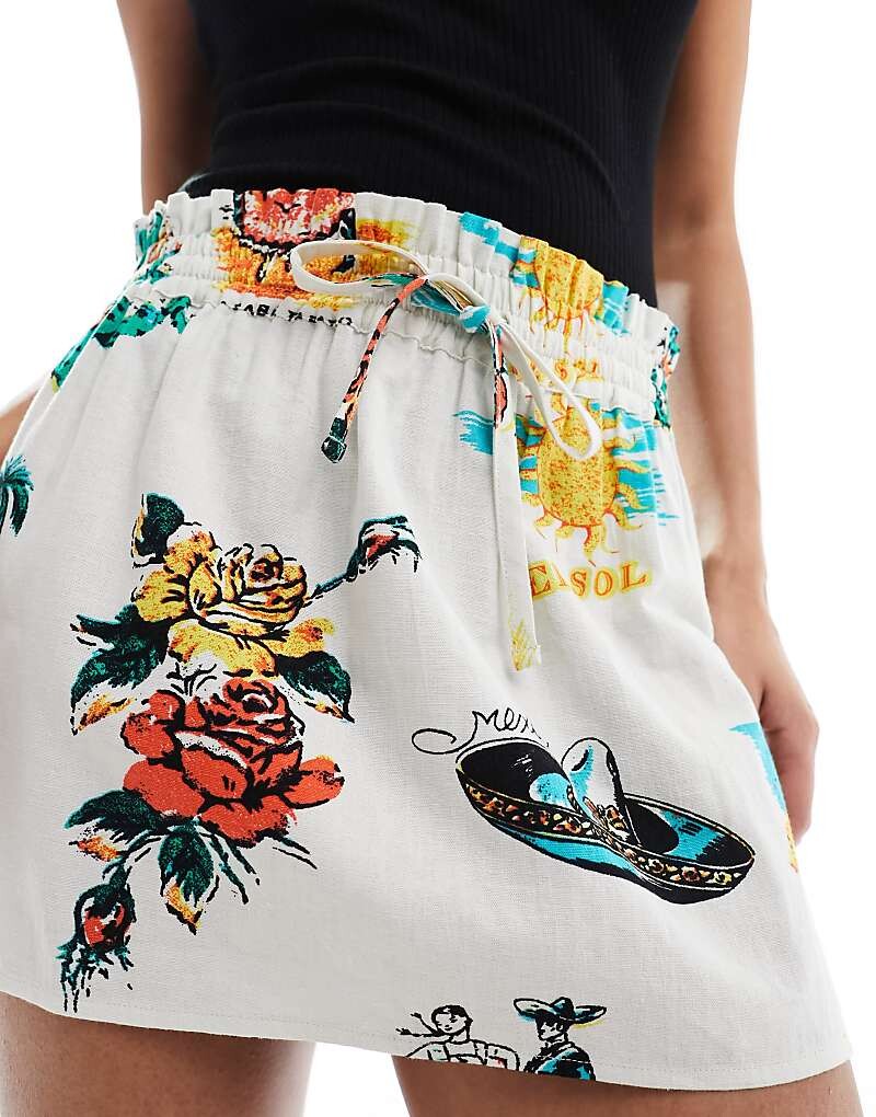 

ASOS DESIGN – Мини-юбка из льна с завязкой на талии в тропическом стиле