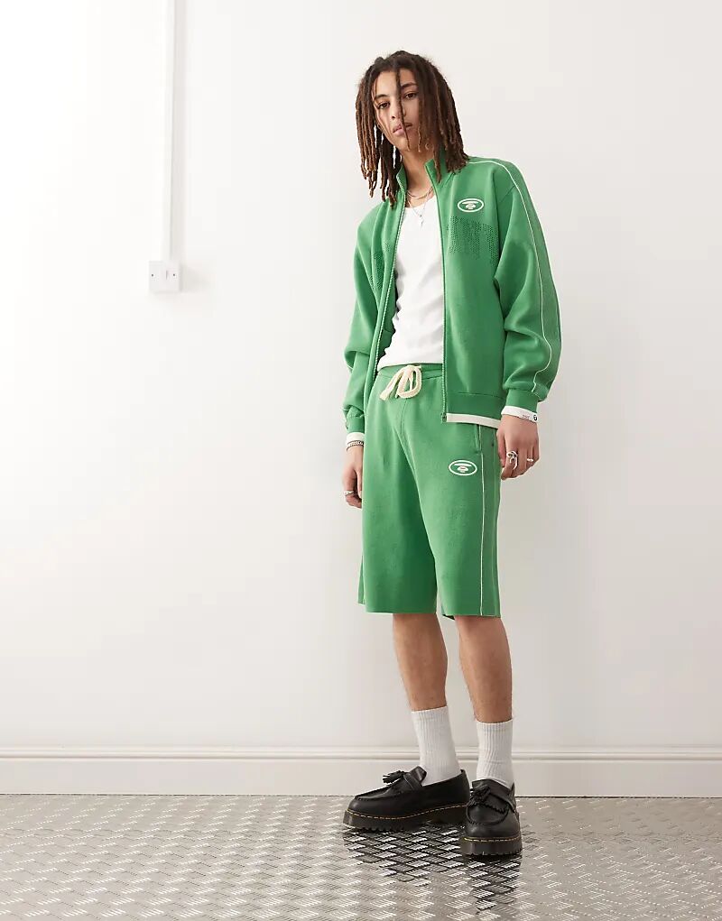 

Свободные трикотажные шорты Aape by A Bathing Ape зеленого цвета с логотипом колледжа Aape By A Bathing Ape
