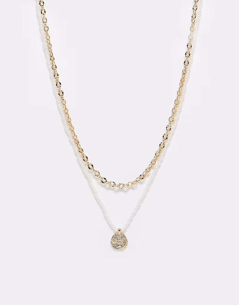 

Набор из двух ожерелий с цепочкой, рядом искусственных жемчужин и текстурированной подвеской золотистого оттенка Asos Design