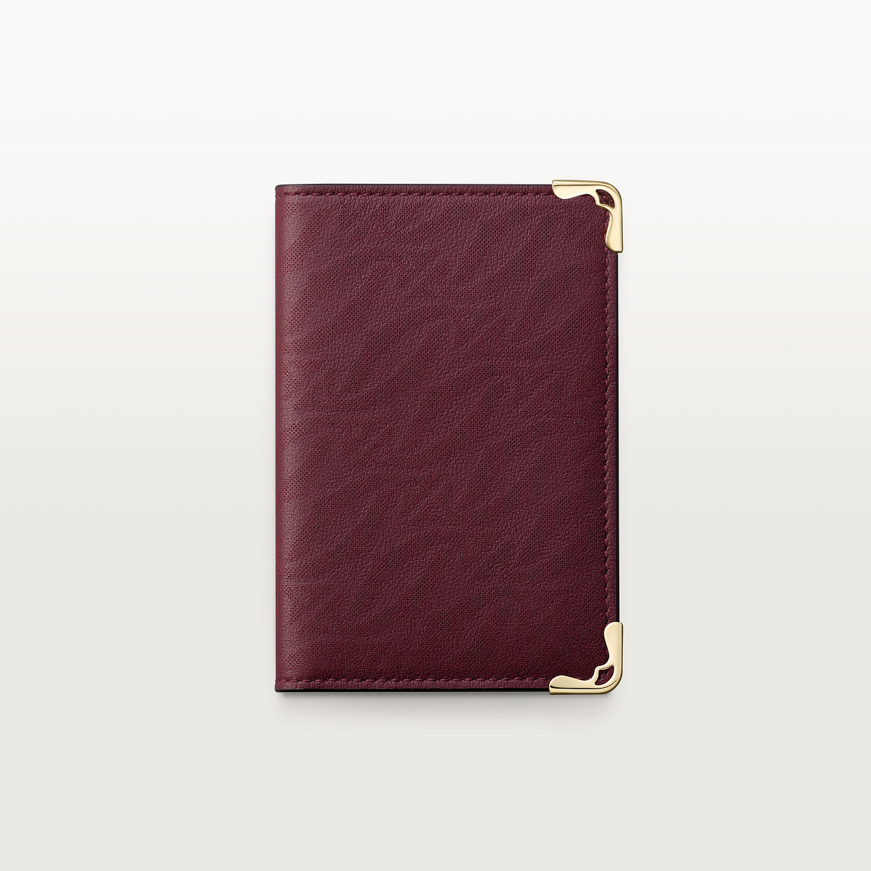 

Картхолдер Cartier Porte-cartes 4 cartes de crédit, Must de Cartier, телячья кожа бордового цвета с перфорированным логотипом
