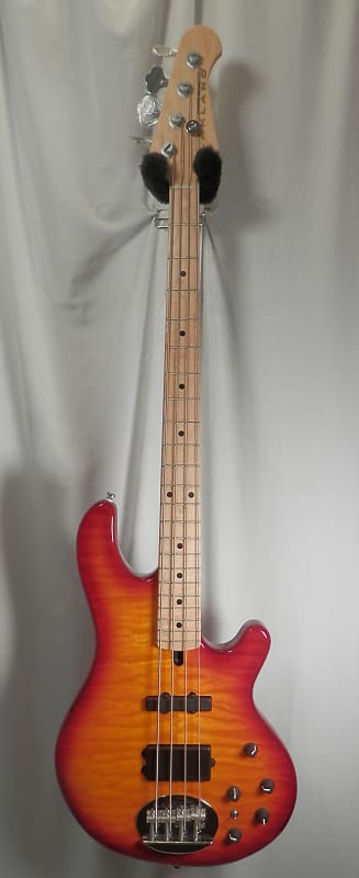 

Басс гитара Lakland 44-02 DLX Skyline Deluxe 4-String Quilt Cherry Sunburst Maple Fingerboard