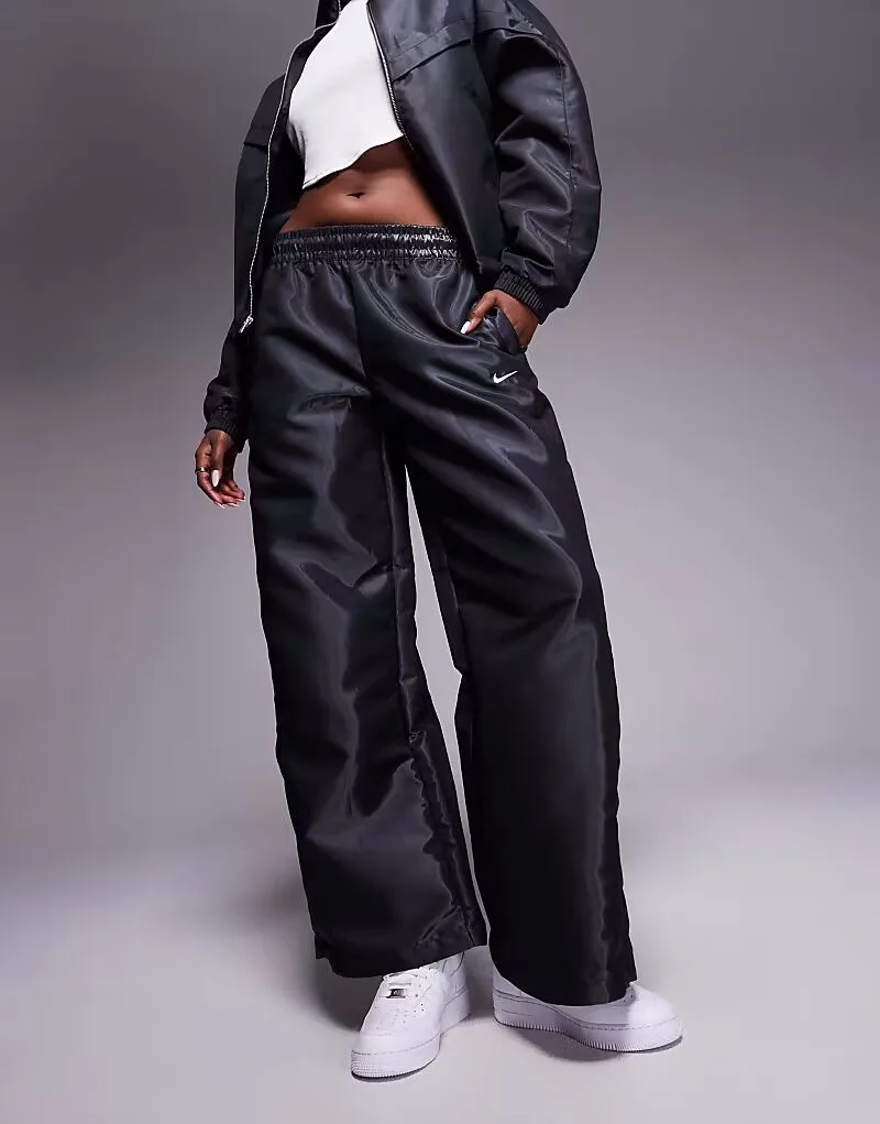 Спортивные брюки Nike Windrunner Liquid Shine черного цвета — фото 4