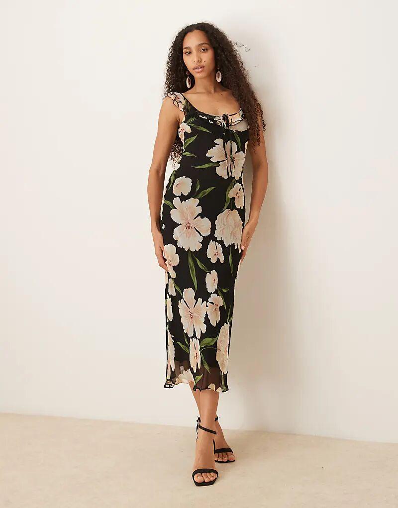 

Платье макси без рукавов с отделкой воланами цвета Mango и темным цветочным принтом