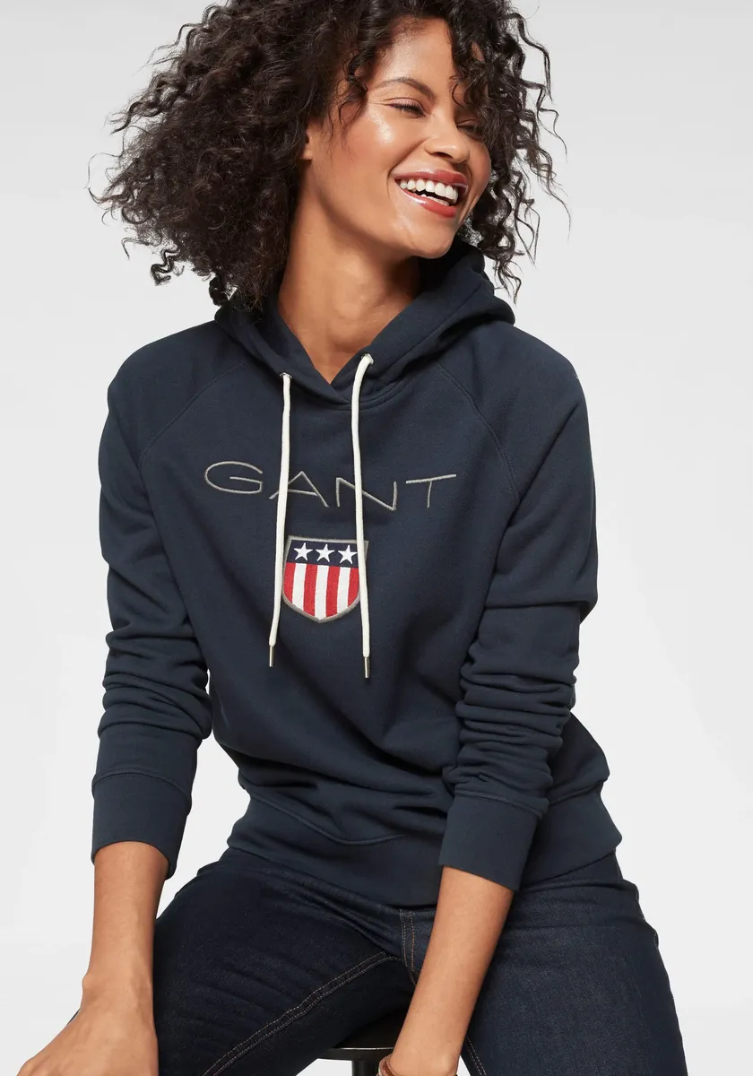 

Толстовка Gant "GANT SHIELD SWEAT HOODIE", с большой этикеткой спереди, цвет морской волны