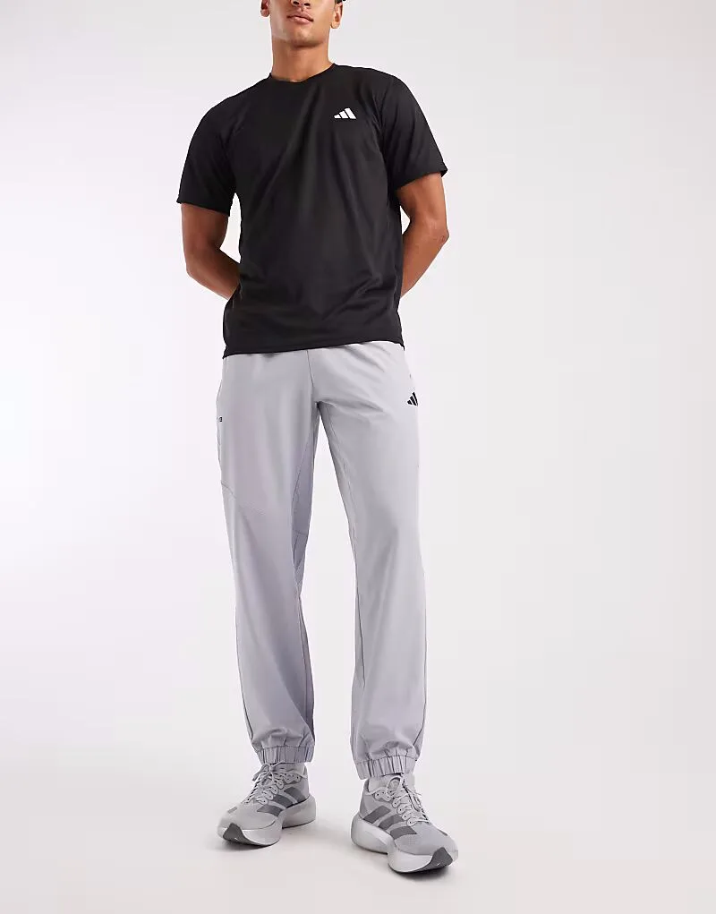 Спортивные брюки Adidas Performance Tech Essentials для тренировок, светло-серые — фото 2