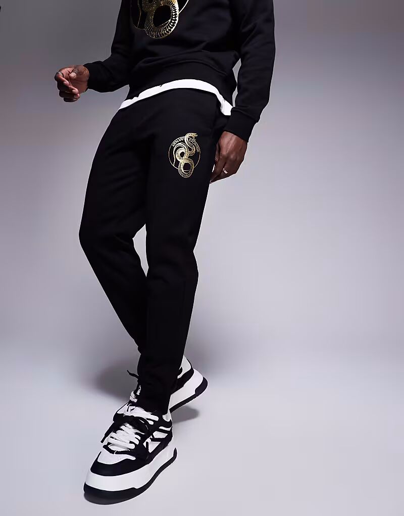 

Armani Exchange Lunar Capsule брюки-джоггеры с принтом змеи черные