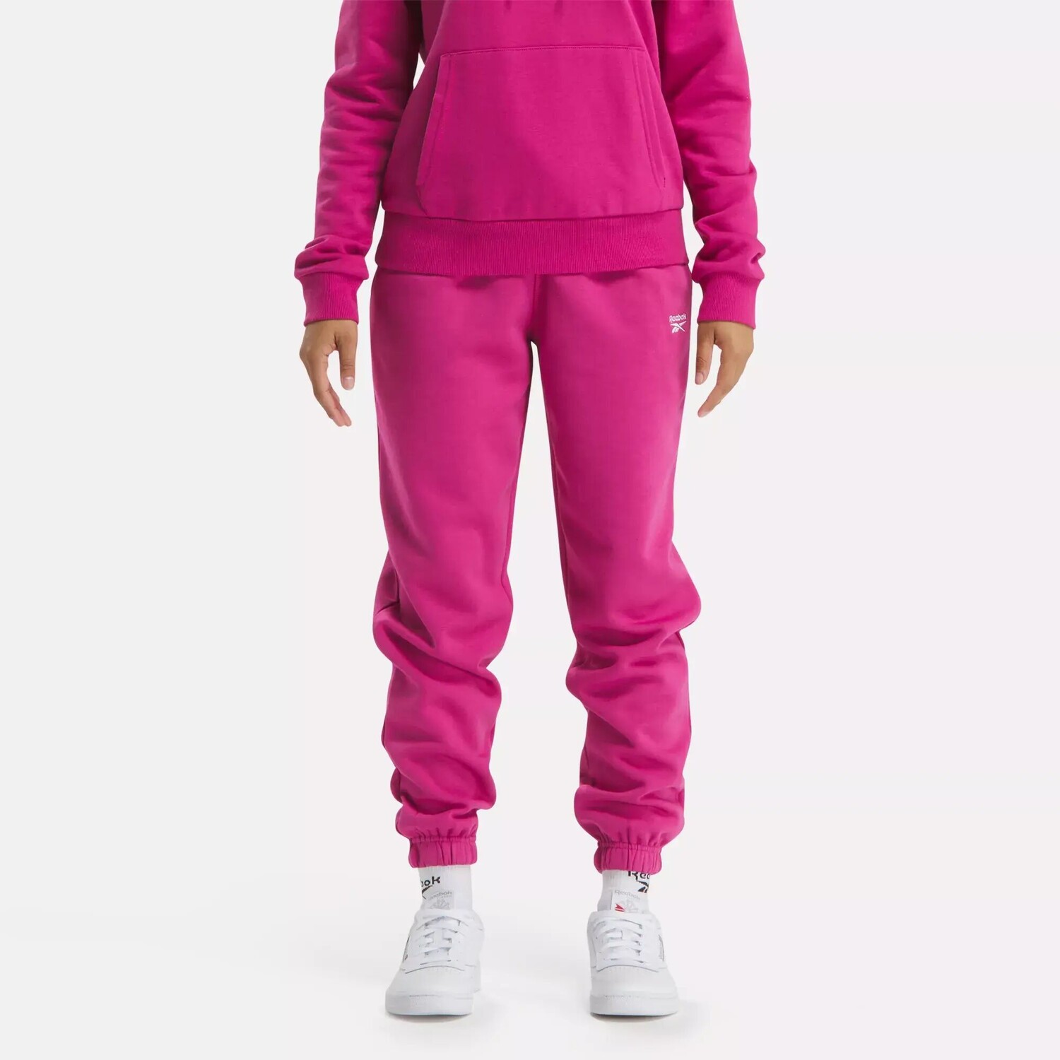

Флисовые джоггеры с маленьким логотипом Identity Reebok, розовый