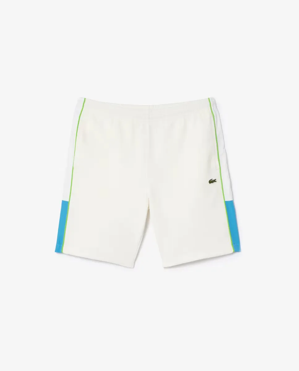 

Короткие мужские двусторонние брюки из пике белого цвета Lacoste