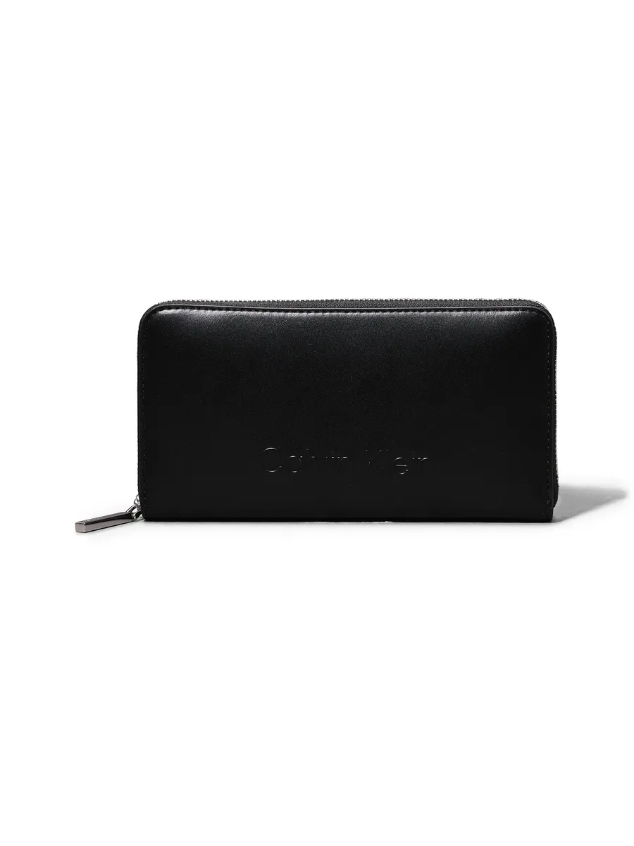 

Кошелек Calvin Klein " LG WALLET НА МОЛНИИ С РЕЗЕЛЬНЫМ ЛОГОТИПОМ ", черный