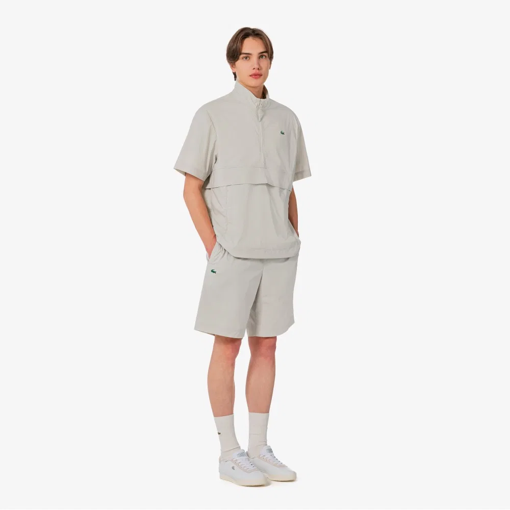 Мужские эластичные шорты из тканого материала бежевые от Lacoste