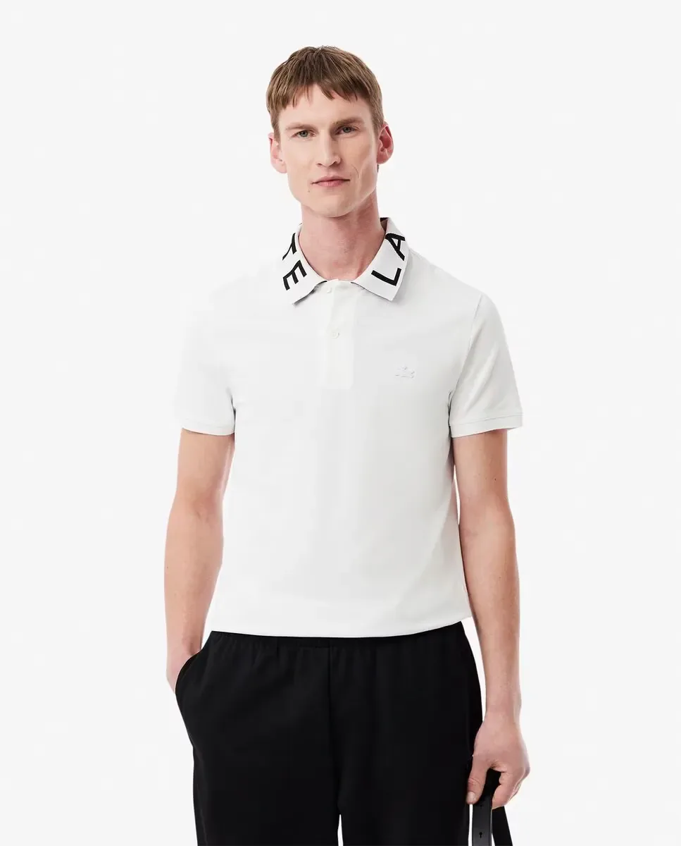 Lacoste Мужское поло приталенного кроя с фирменными деталями из жаккарда белого цвета с коротким рукавом