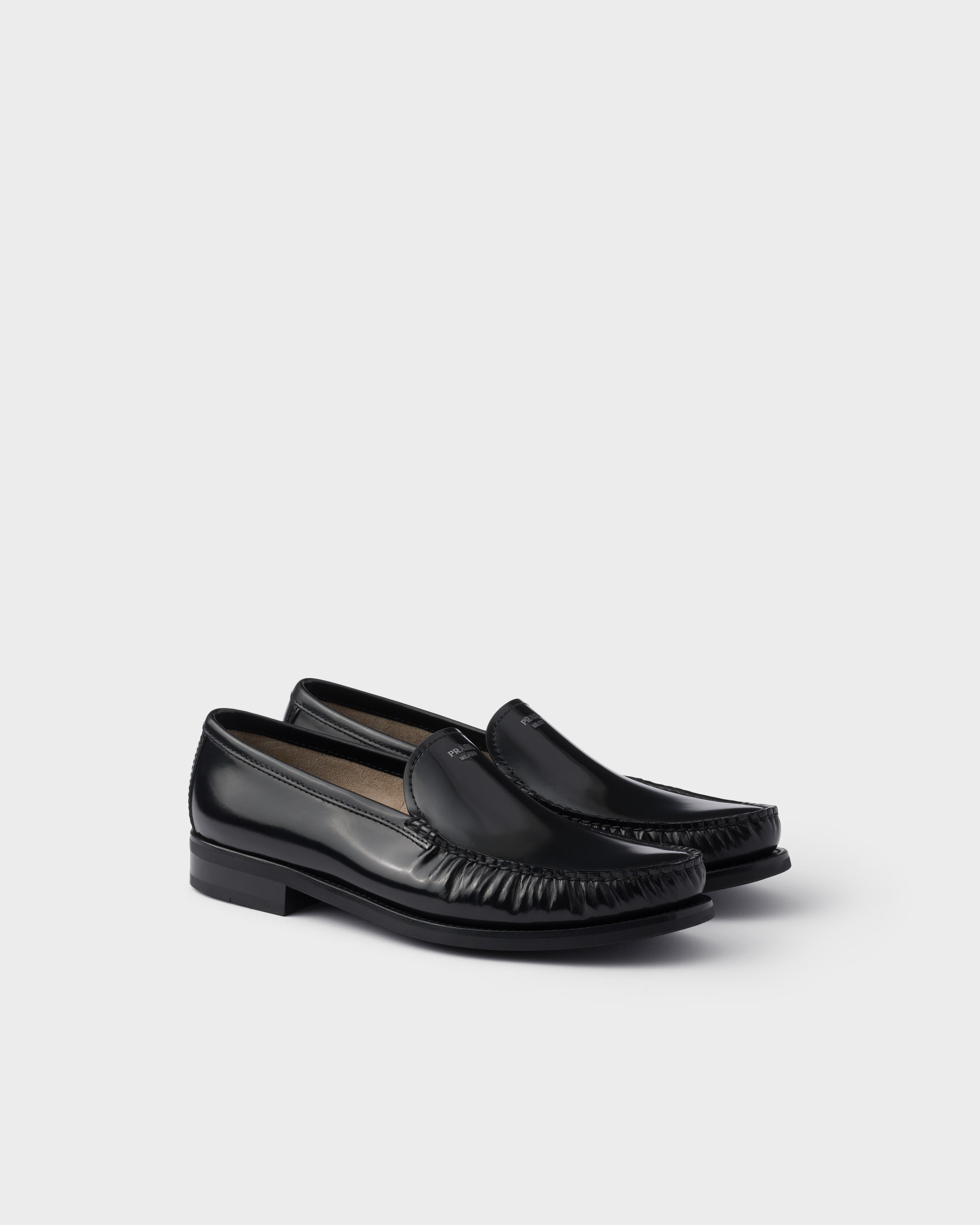 

Лоферы из полированной кожи Prada, черный